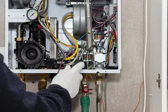 NexAir Home Services technician reviewing tankless water heater placement in Winfield, WV. Tankless Water Heater Installation Near Me.