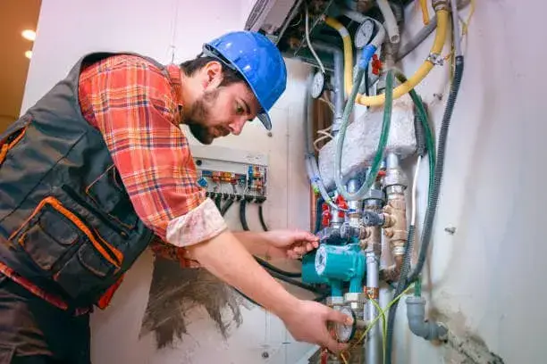 Technician evaluating household hot-water demand for a tankless water heater in St. Albans, WV.
